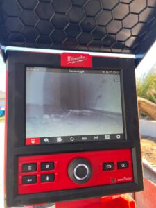 CCTV drain inspection camera showing pipe blockage