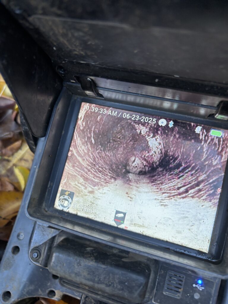 CCTV drain camera showing blockage inside sewer pipe during inspection