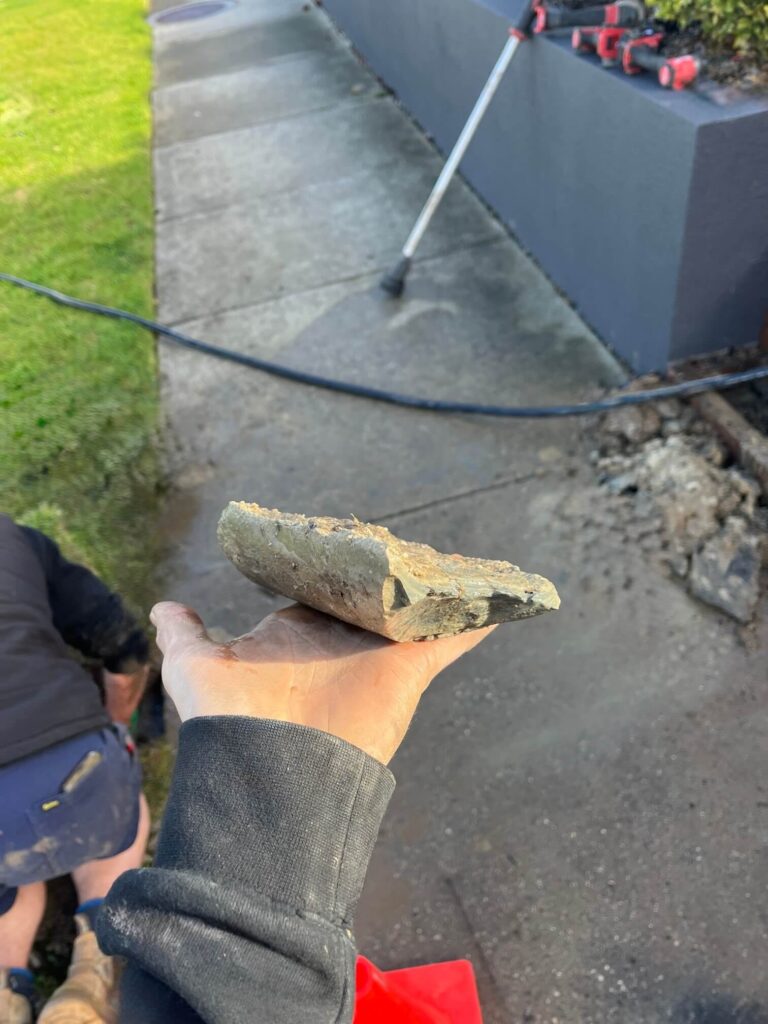 Broken stormwater pipe section removed during repair