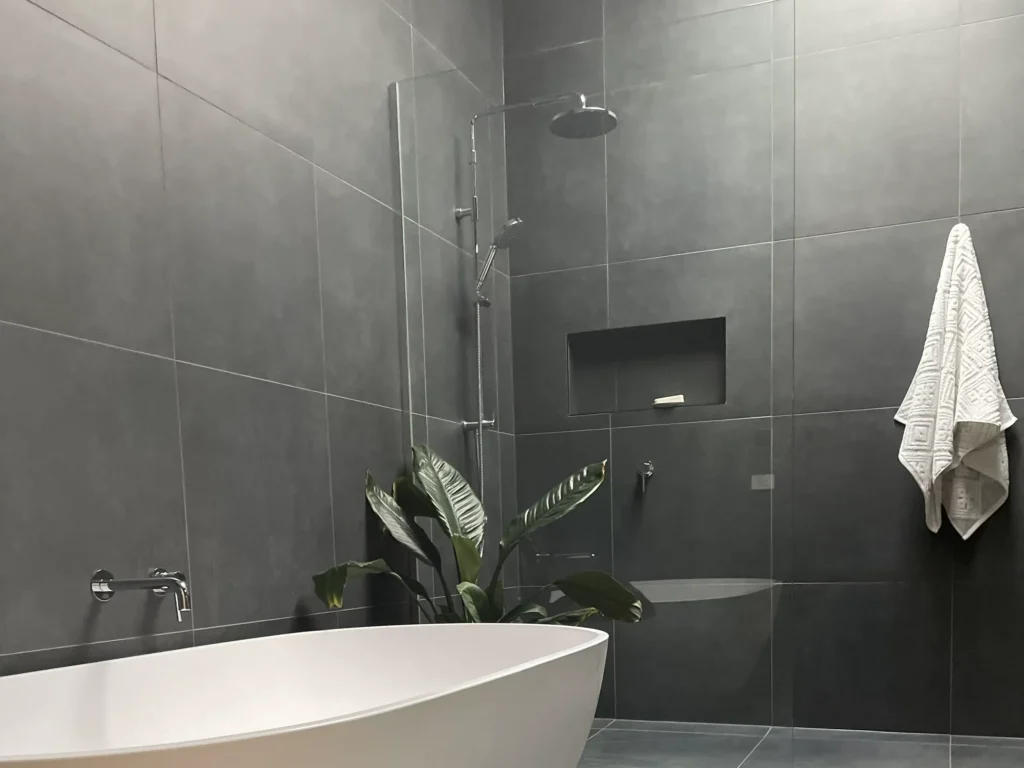 A modern styled bathroom with a deep bathtub.