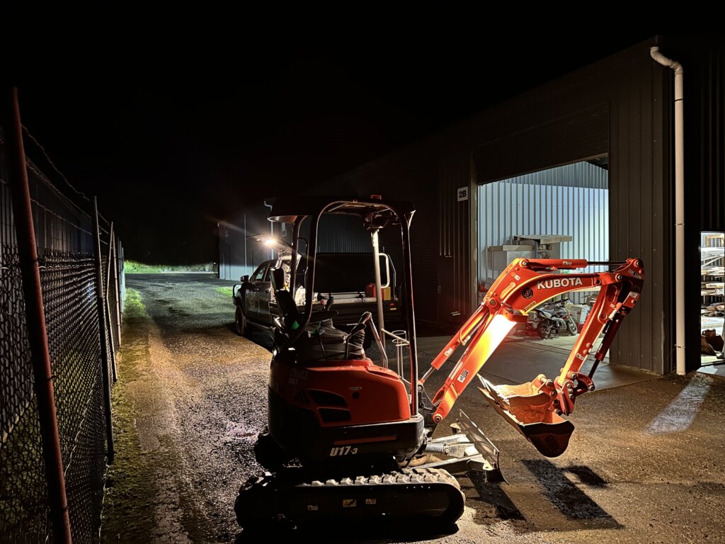 Early starts for the team Excavator parked at night.