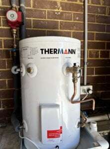 Thermann Hot Water Systems & Electric Storage installed against a brick wall by Bay Plumbing and Drainage