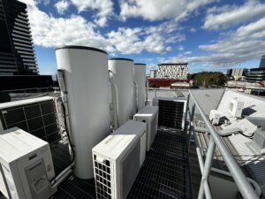 3 roof-mounted heat pump hot water systems on a commercial building in Geelong CBD