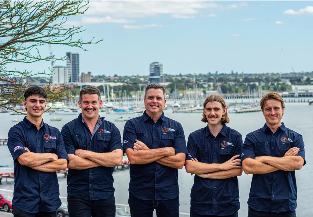 Bay Plumbing & Drainage team in uniform.