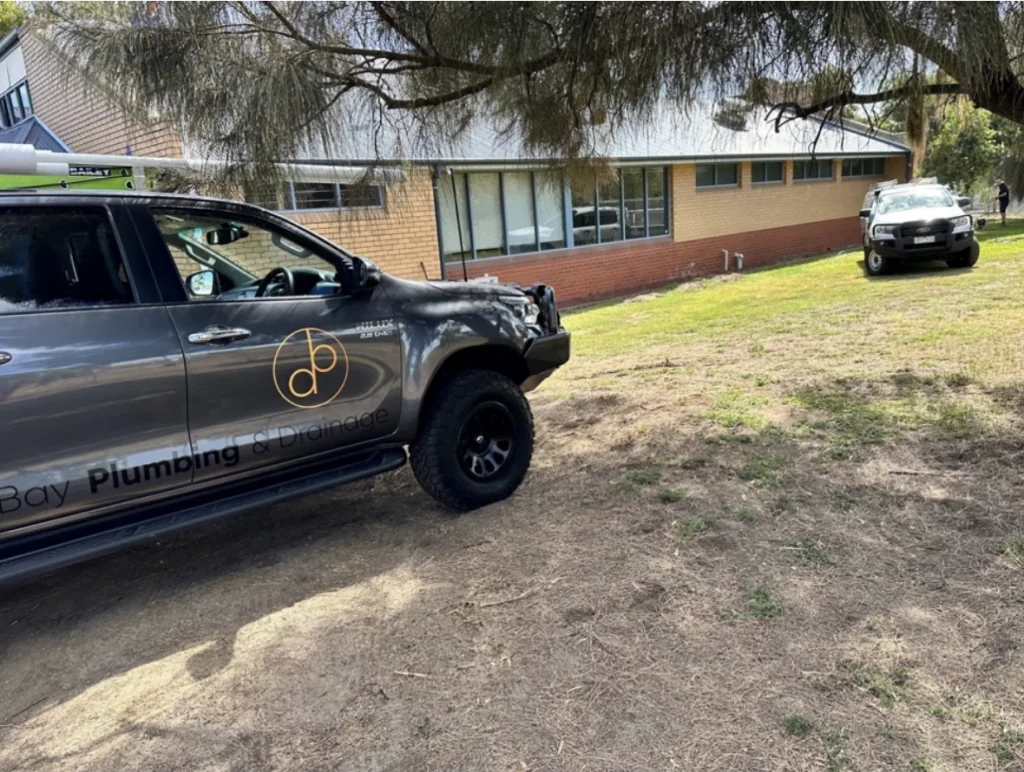 Bay Plumbing and Drainage vehicle parked on site during a commercial service call in Geelong.