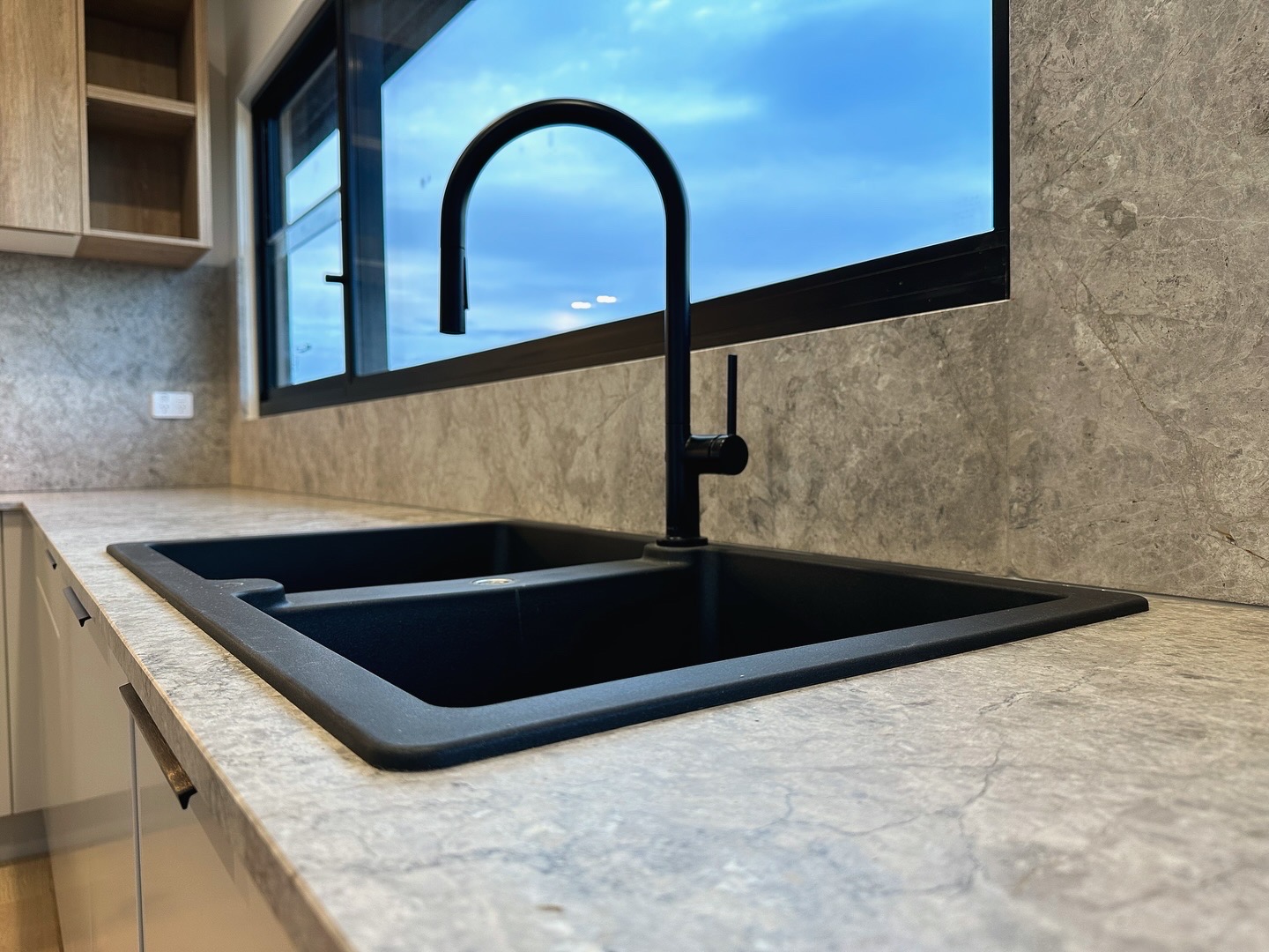 Modern kitchen sink with window view