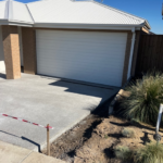 House with garage and landscaping