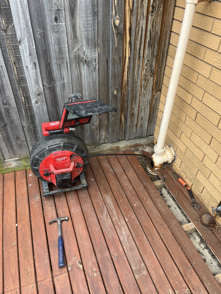 Sewer line locator equipment tracing sanitary drain path near residential unit in Newtown Geelong VIC